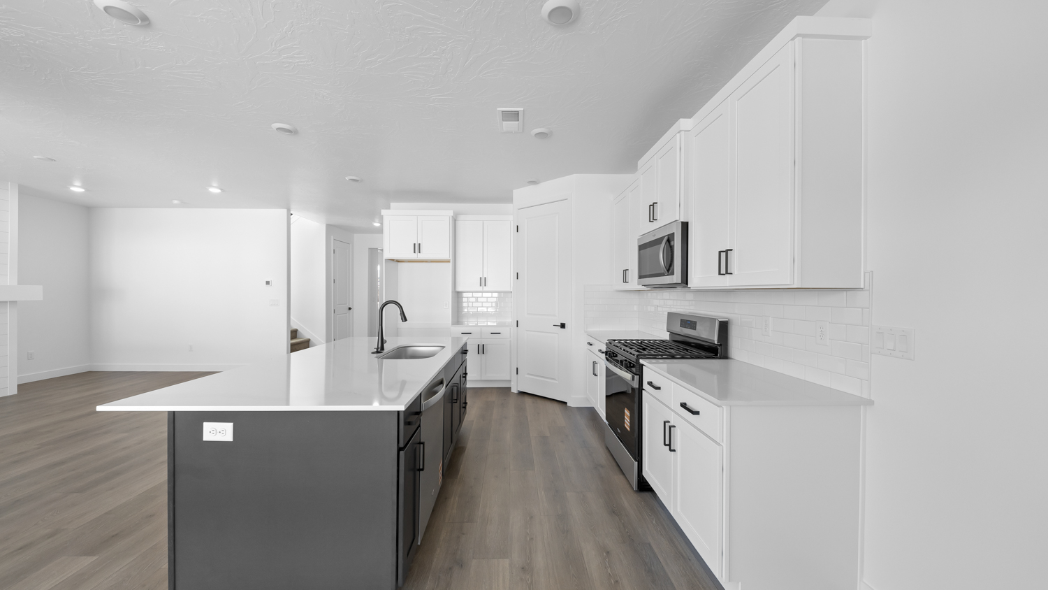 Kitchen with kitchen island and cabinets.
