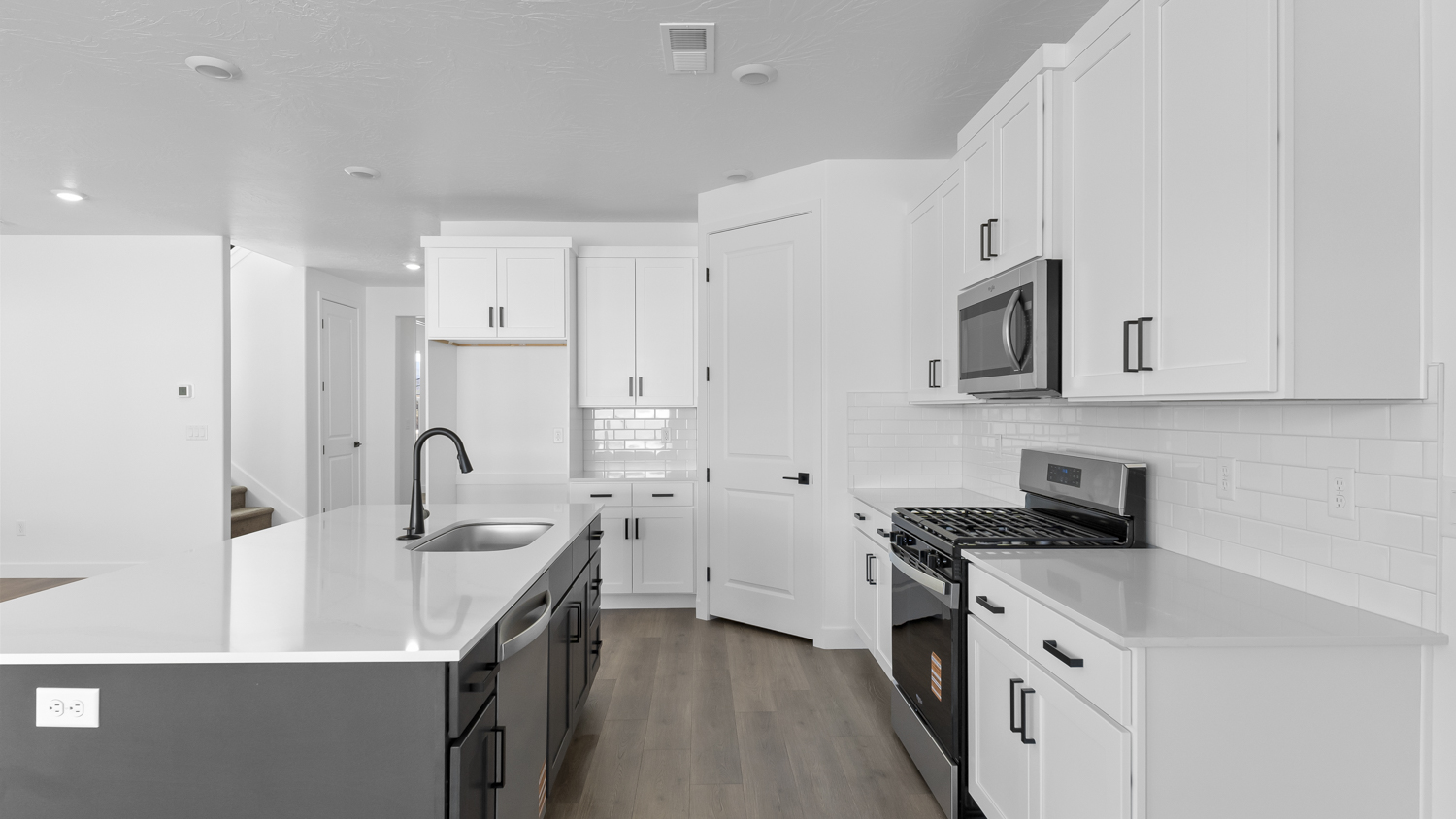 Kitchen with kitchen island and cabinets.