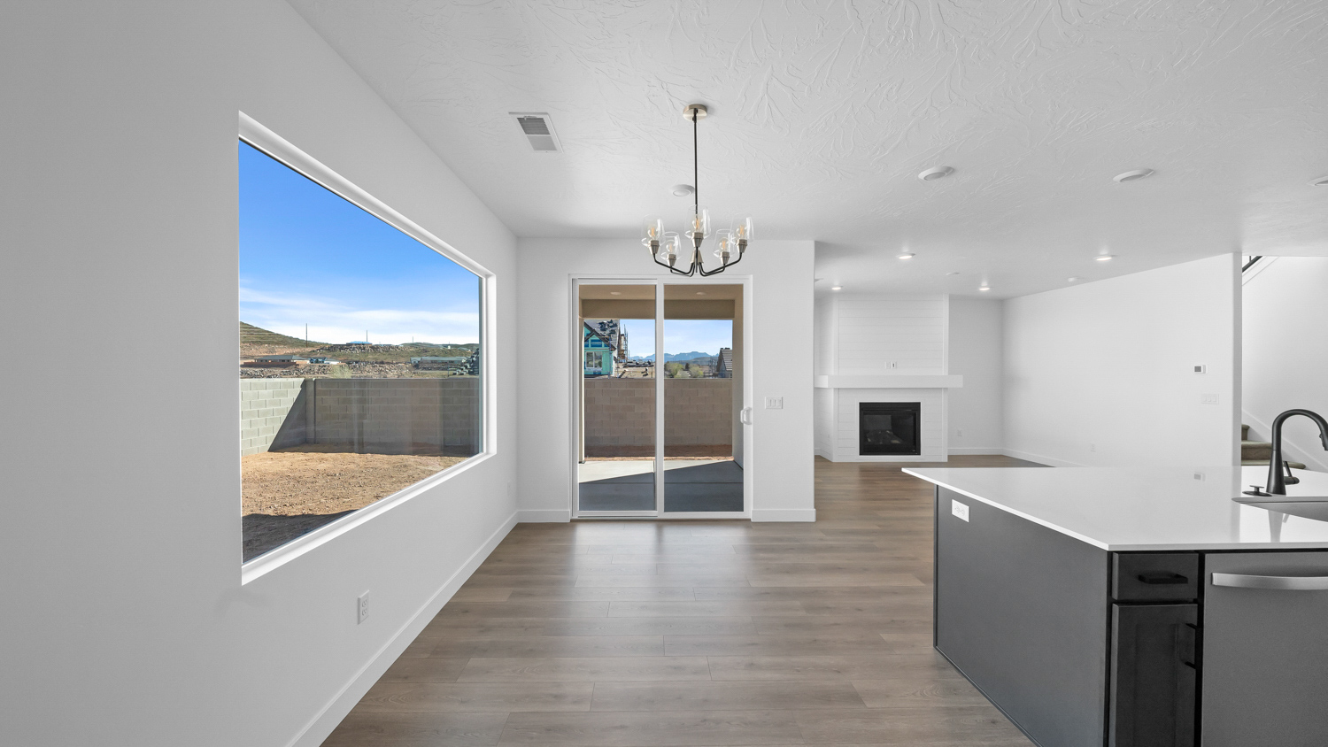 Dining room with large window and patio doors.