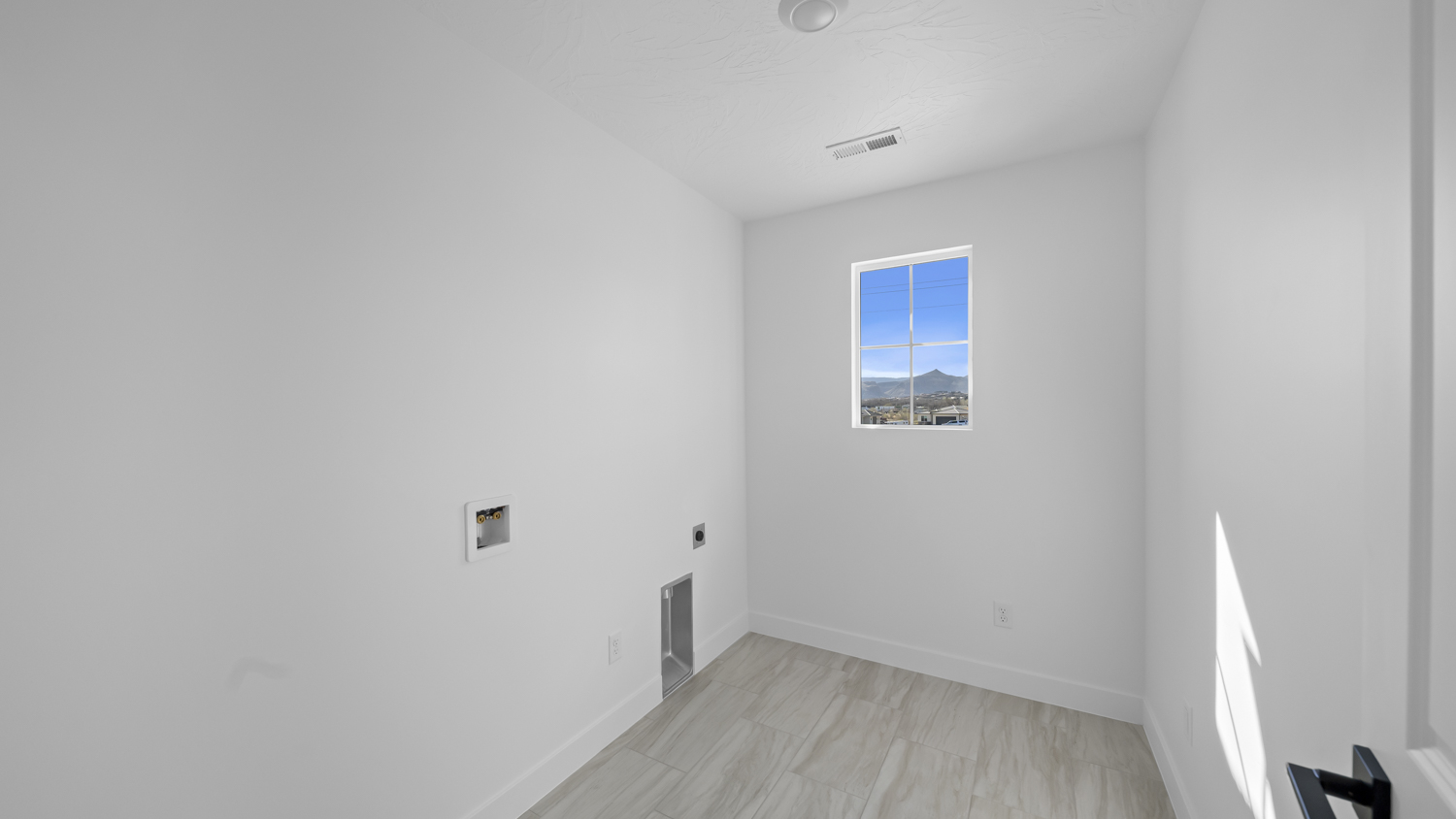 Laundry room with window.