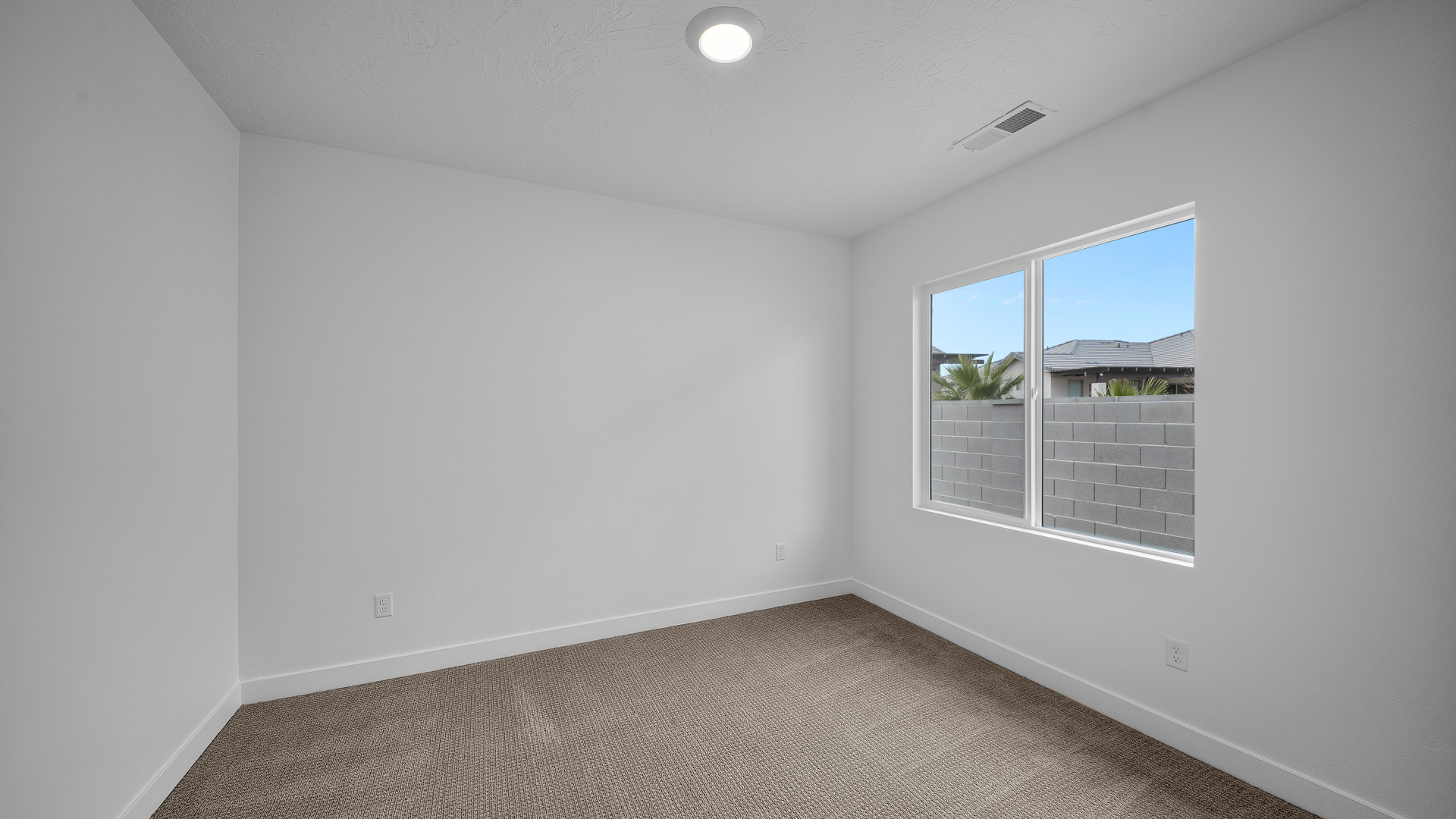 Bedroom with large window.