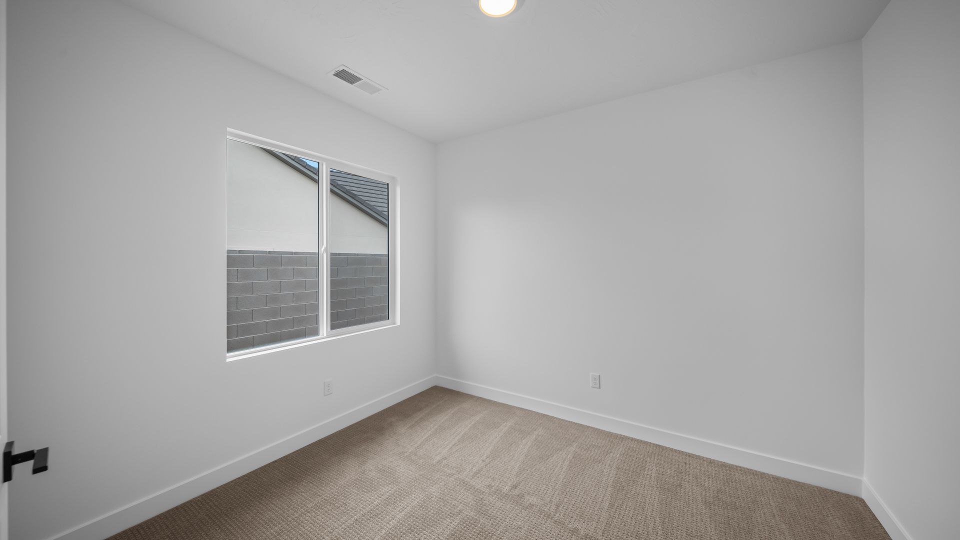 Bedroom with large window.