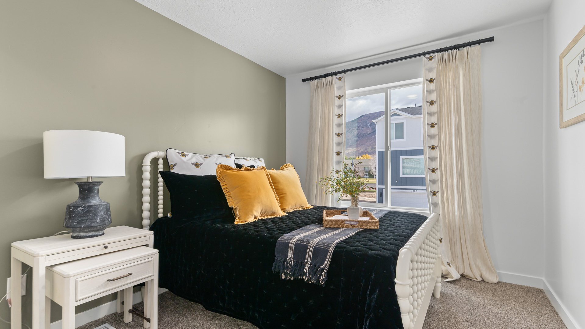 Bedroom with large window and closet.