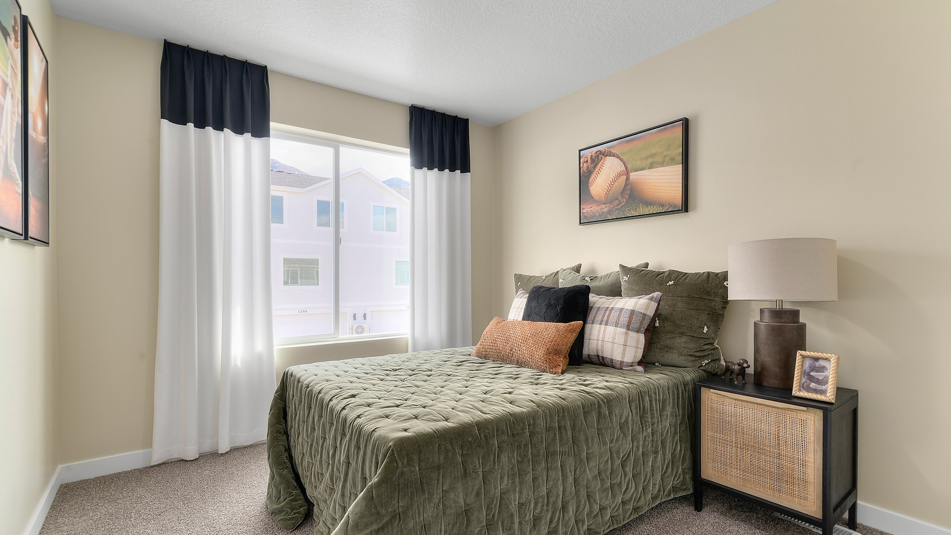 Bedroom with large window and closet.