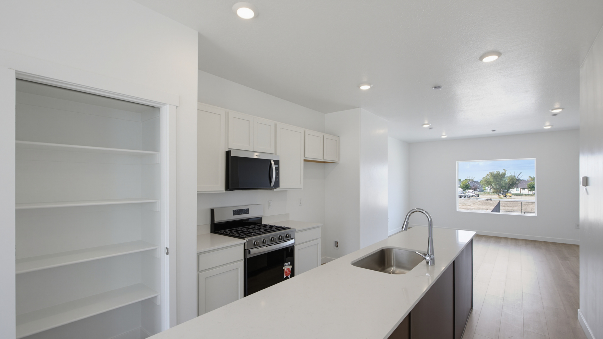 Modern open-concept kitchen with large island.