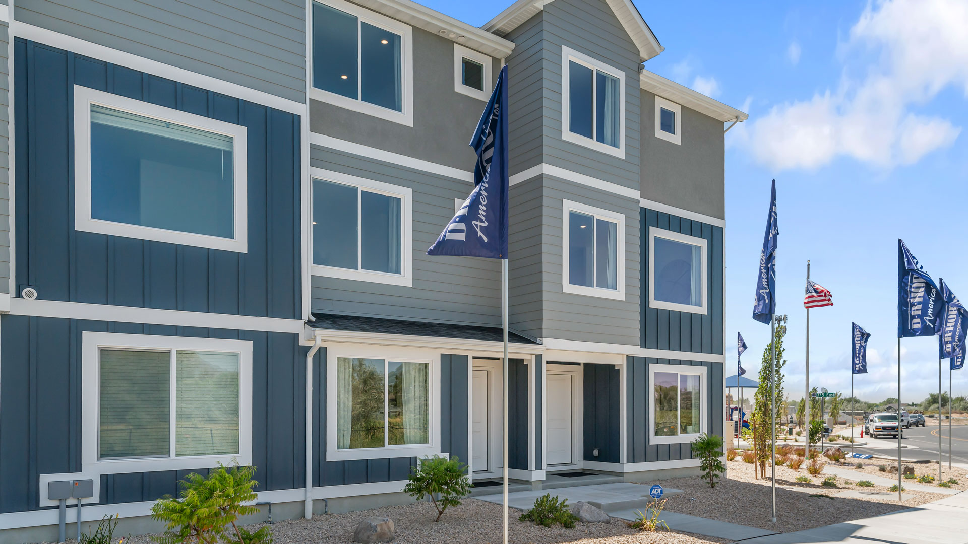 New three-story townhome end-unit with covered porch in Harrisville Utah.