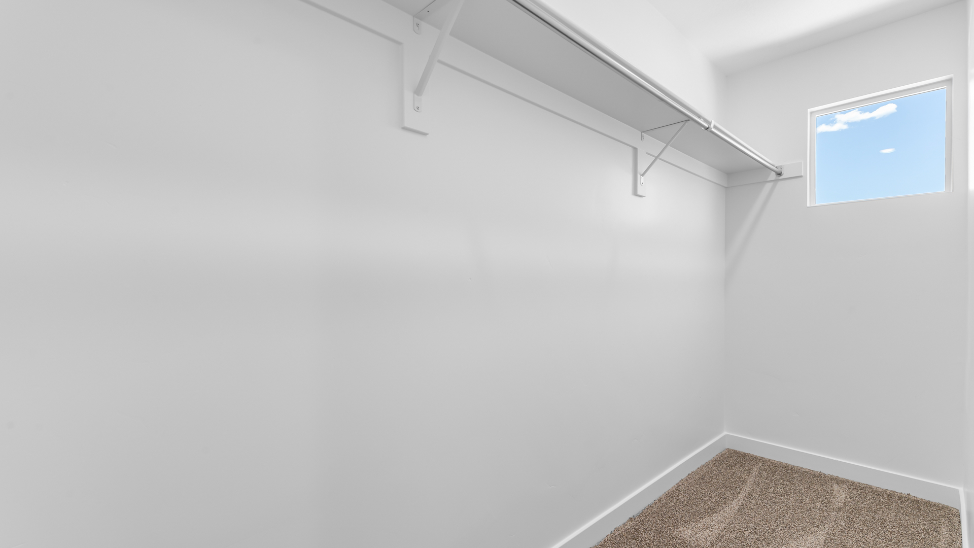 Walk-in closet with window.