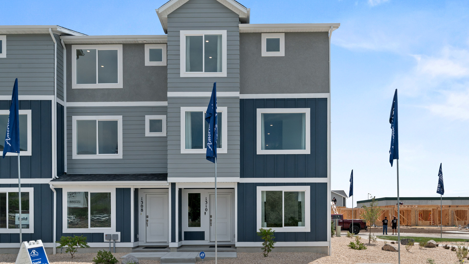 New three-story townhome end-unit with covered porch in Harrisville Utah.