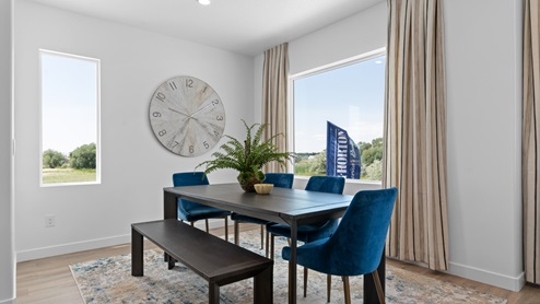 Dining space with two windows.