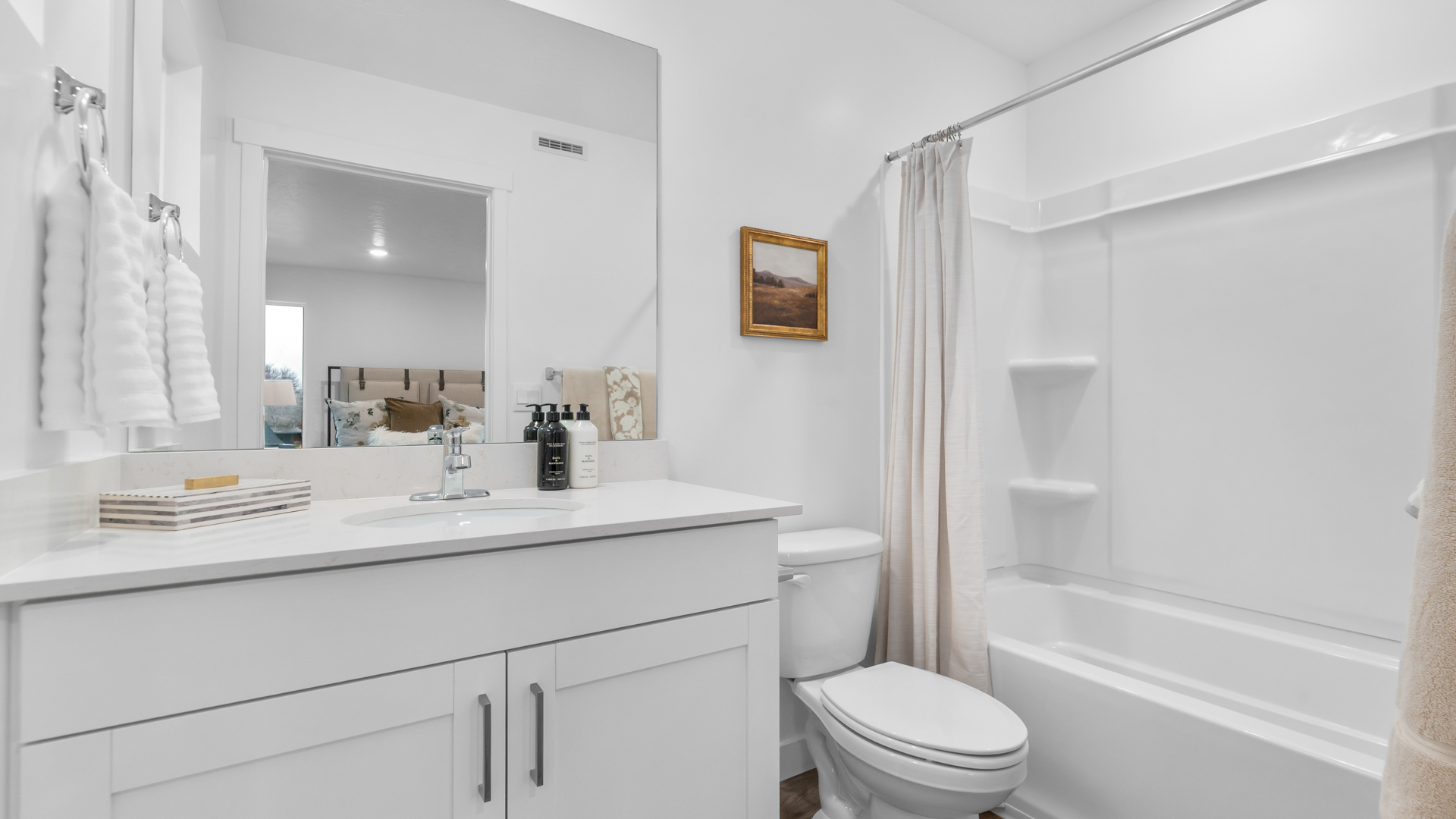 Primary bathroom with shower surround.