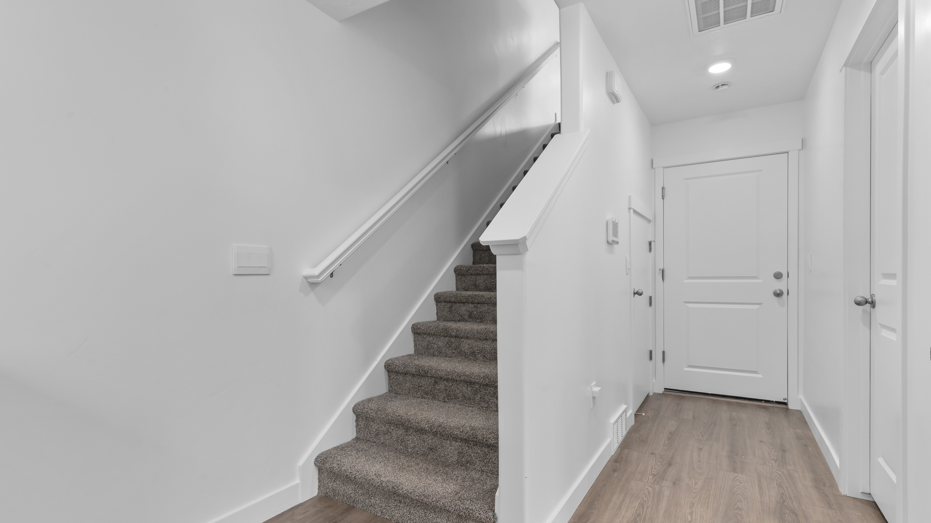 Stairs and hallway on main floor of Midtown Village Haven in Ogden