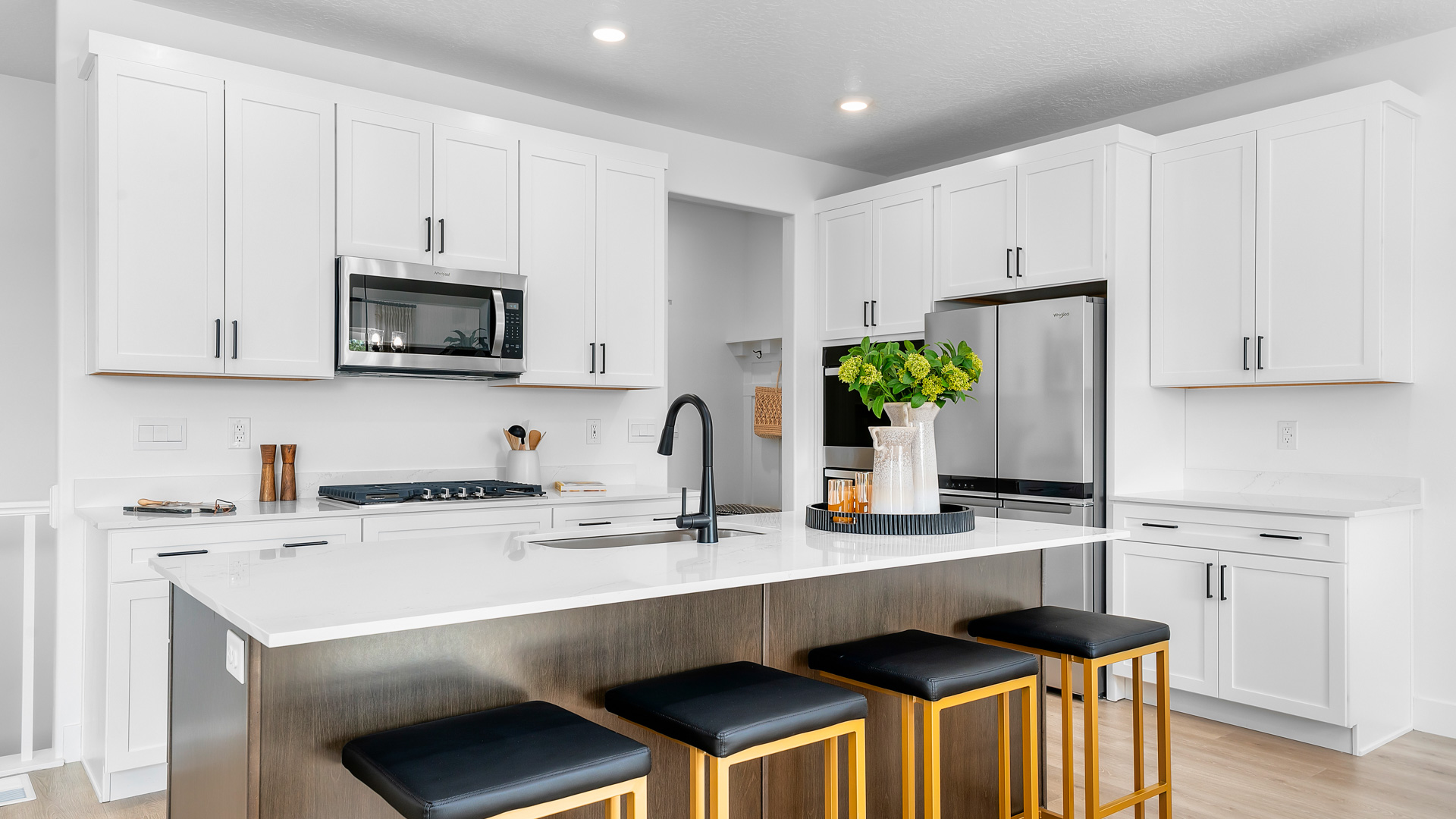 Kitchen with stainless steel appliances and kitchen island.