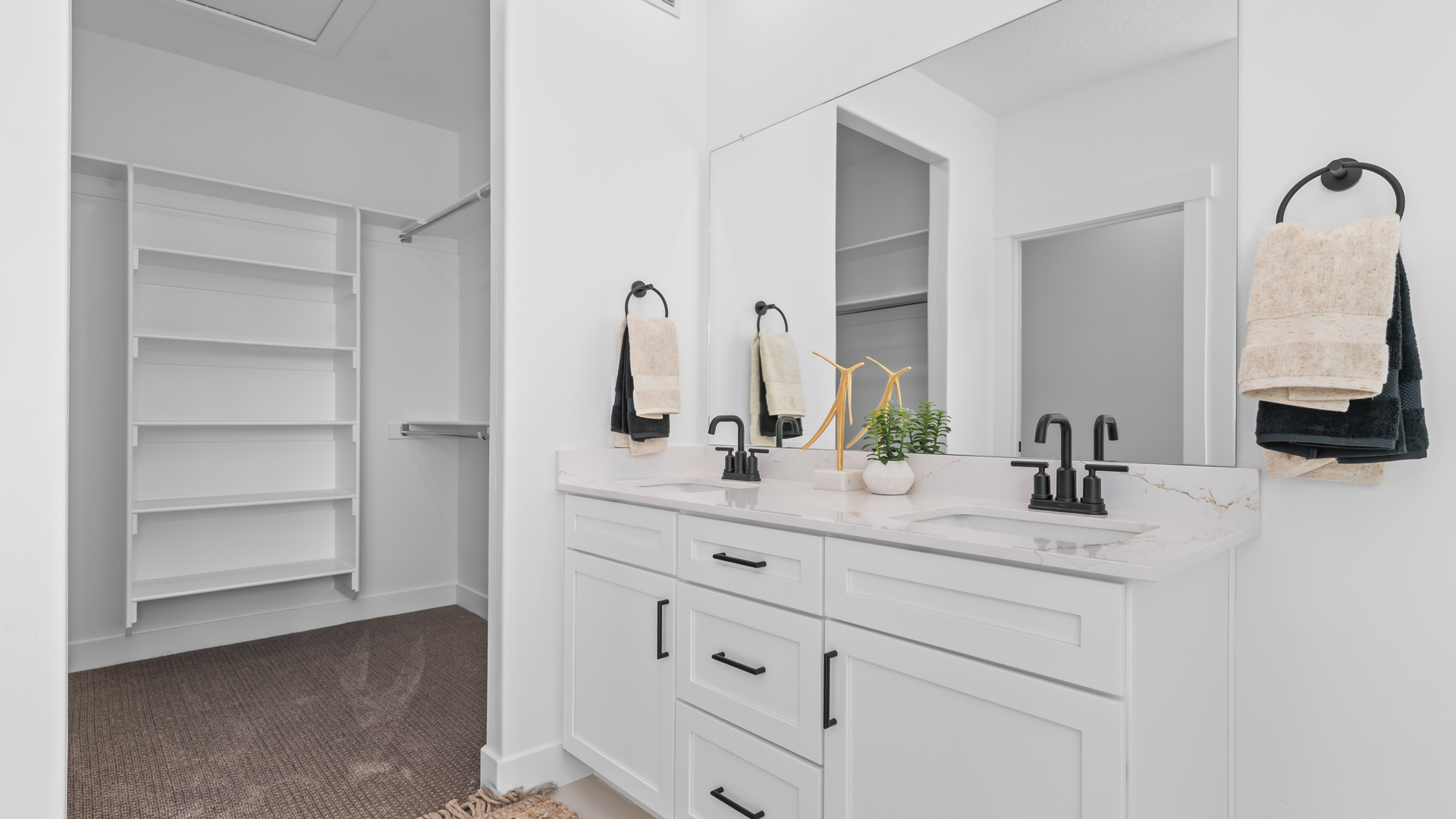 Primary bathroom with double sink vanity.