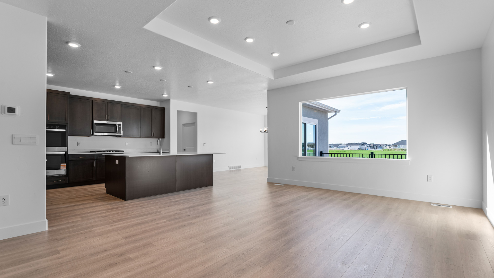 Main living space featuring family room, kitchen, and dining room.