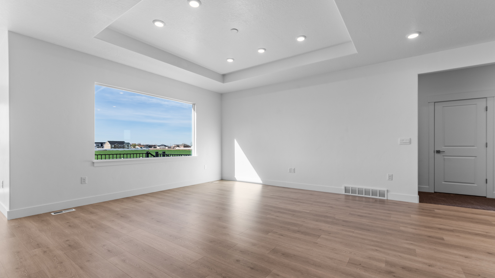 Family room with tray ceilings.