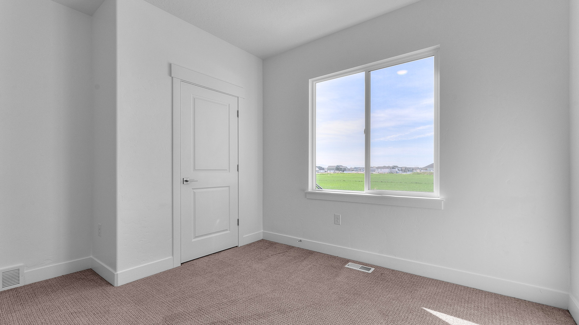 Bedroom with large window.