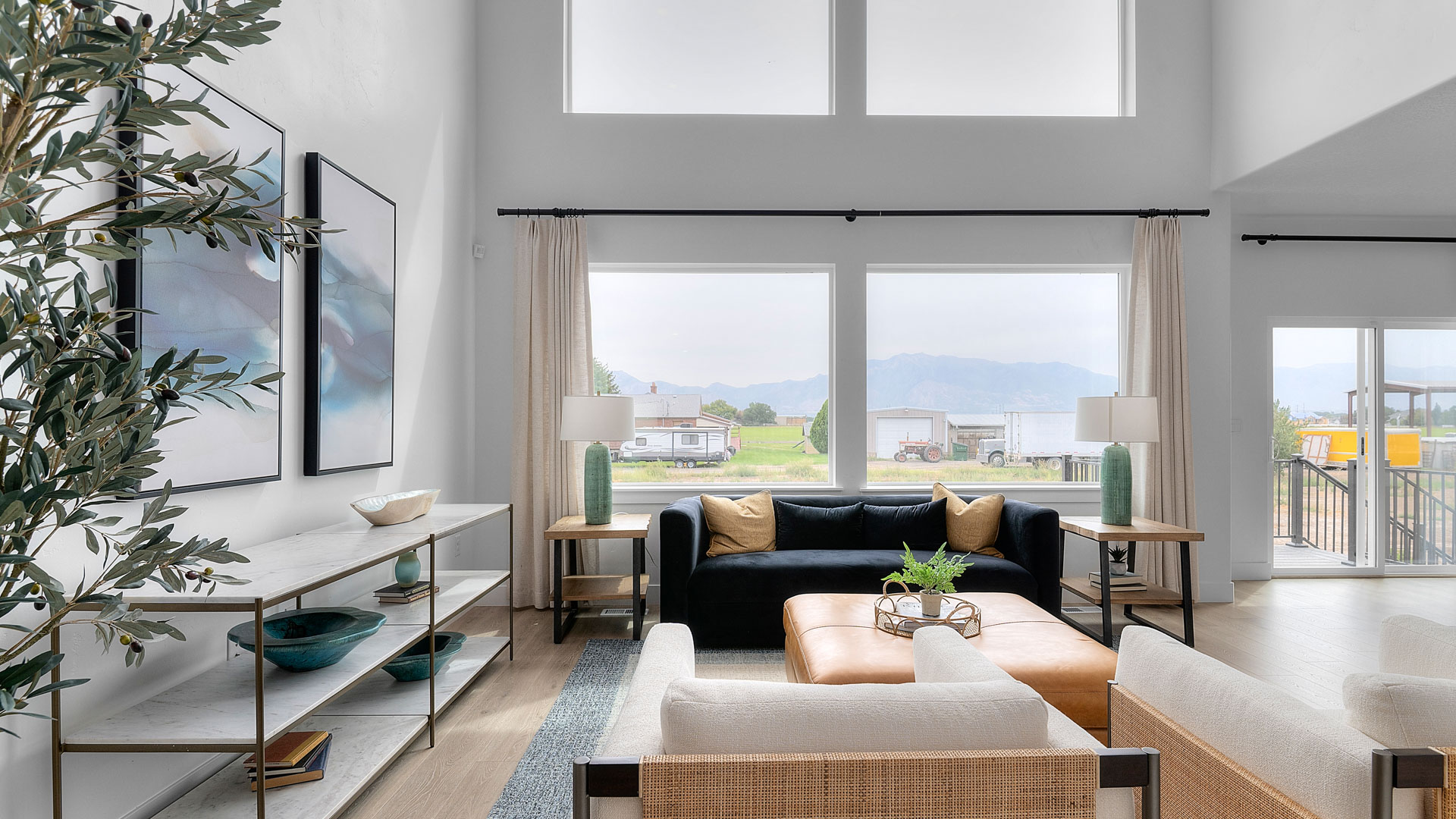 Family room with two story windows.