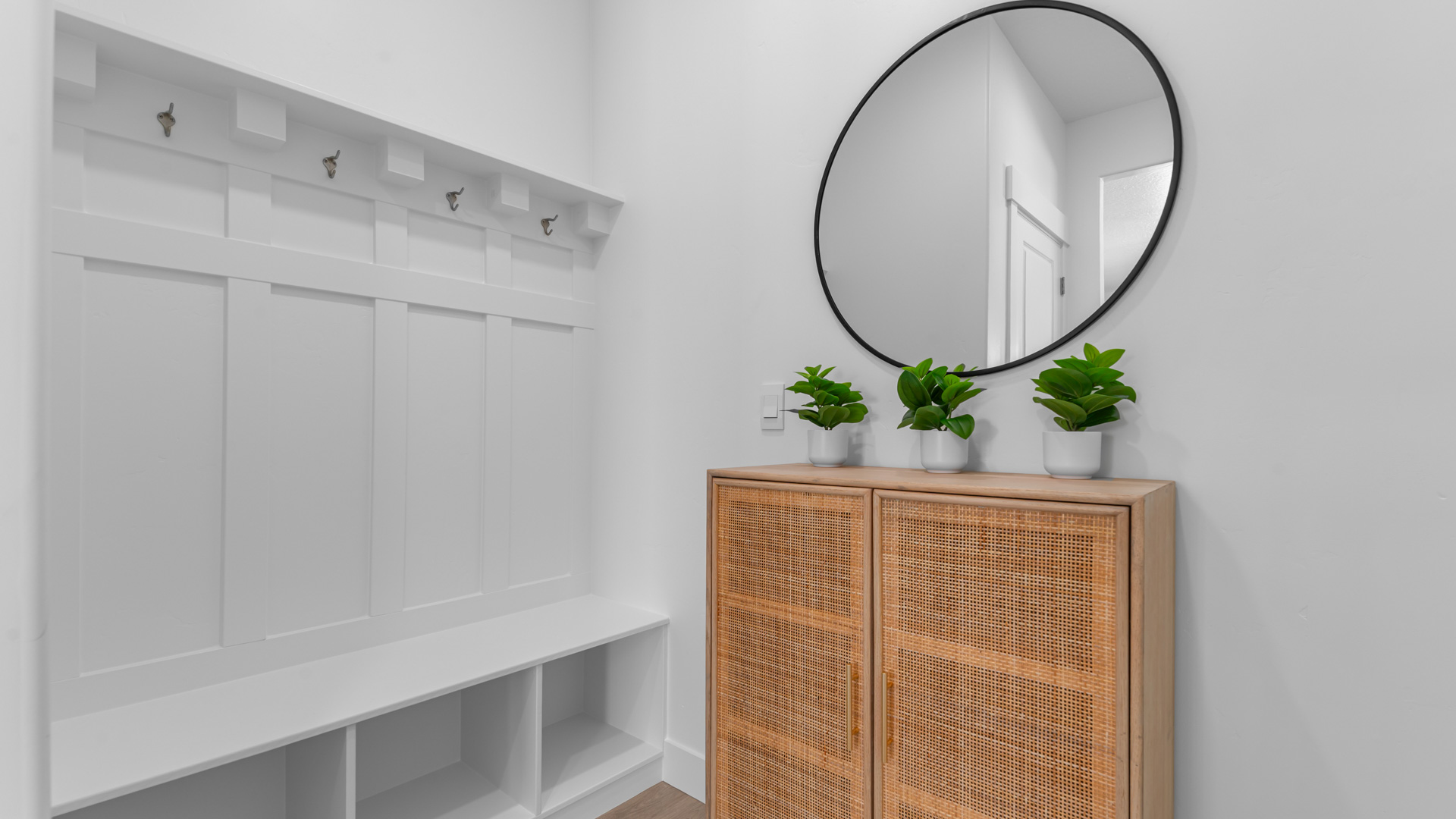 Mudroom with mudroom bench and storage.