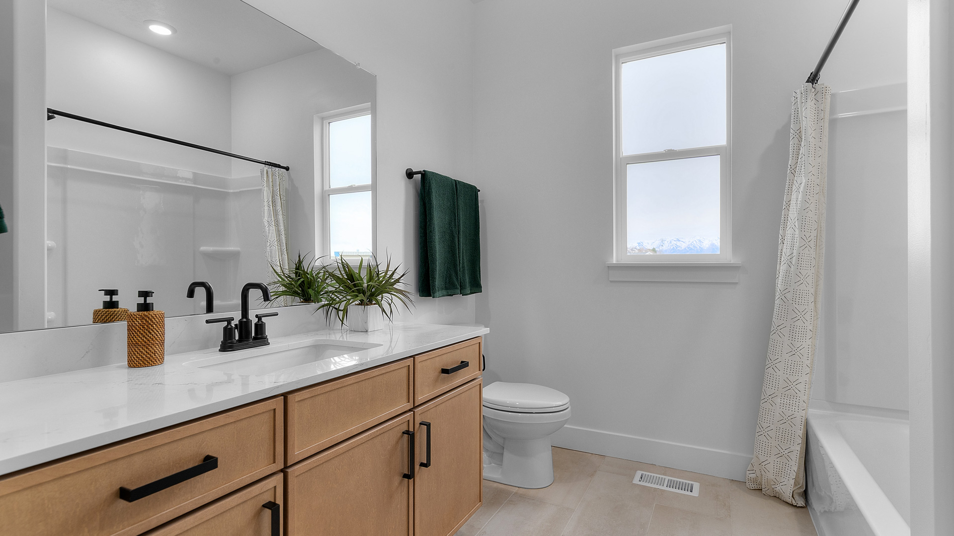 Bathroom with window and shower surround.