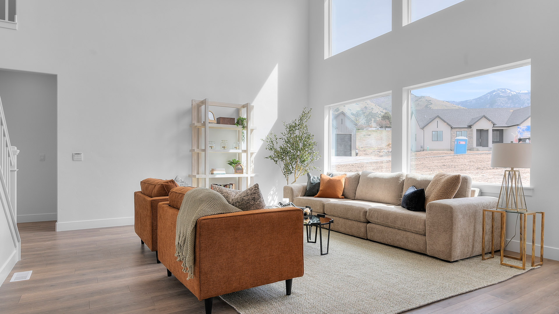 Family room with two story windows.