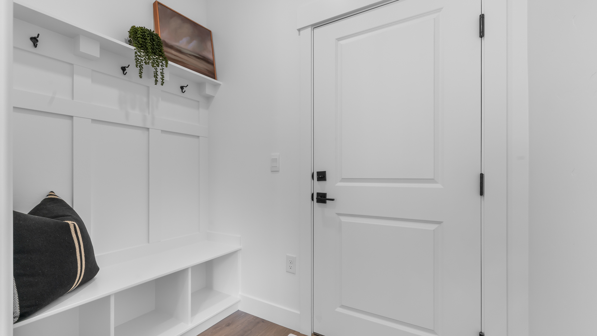 Mudroom with mudroom bench and storage.