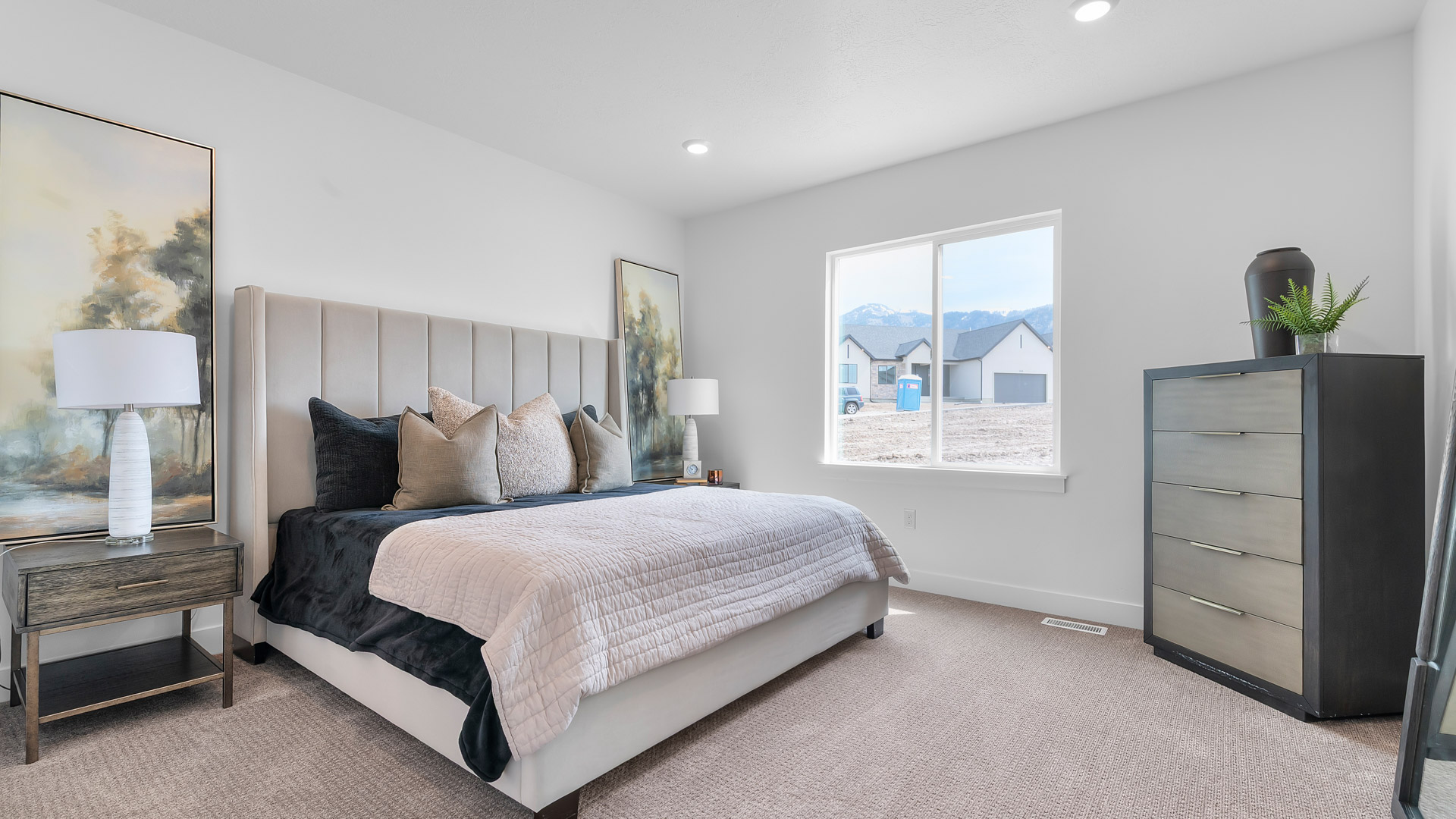 Primary bedroom with large window.