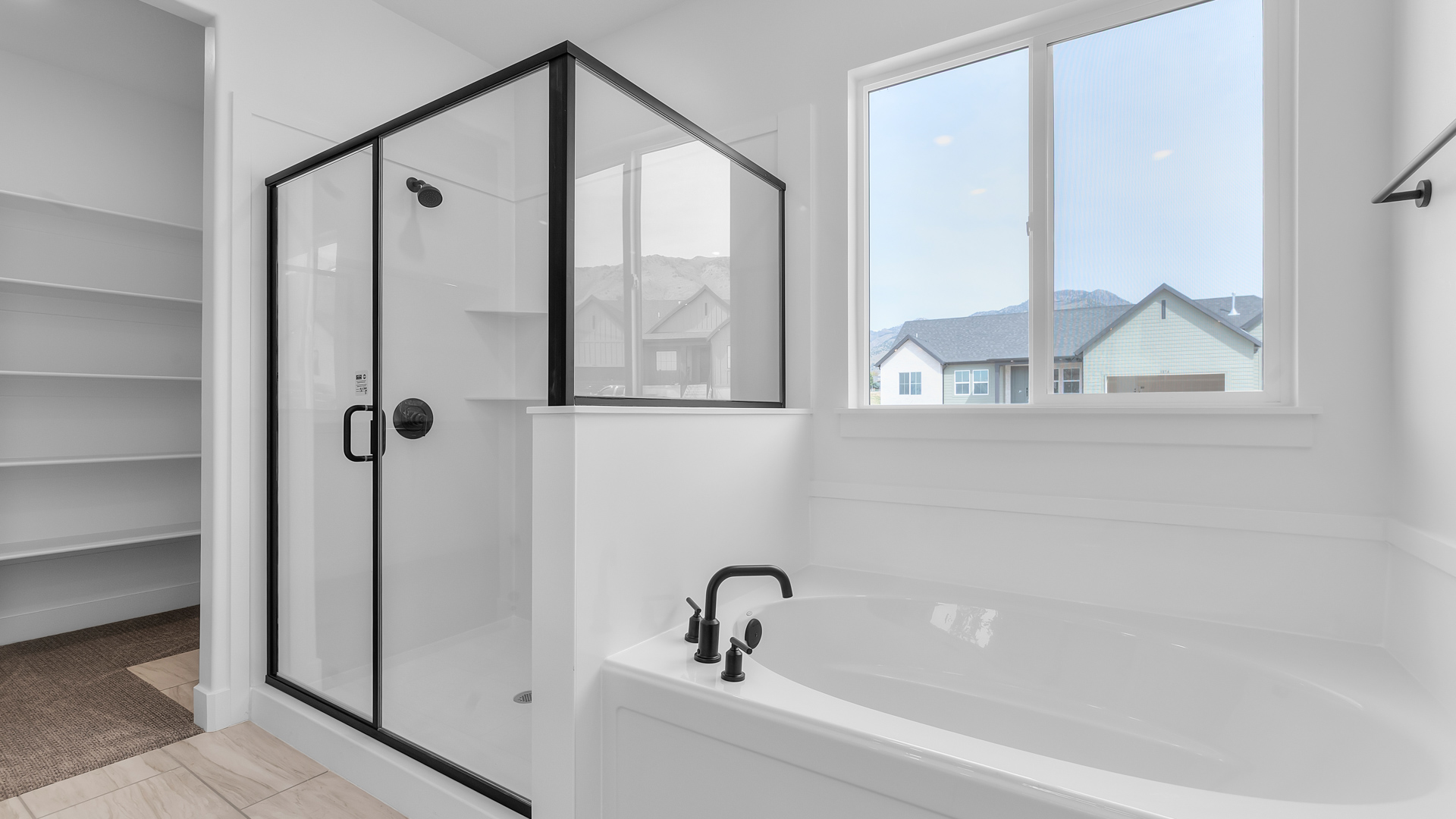 Bathroom with shower and bath and window.