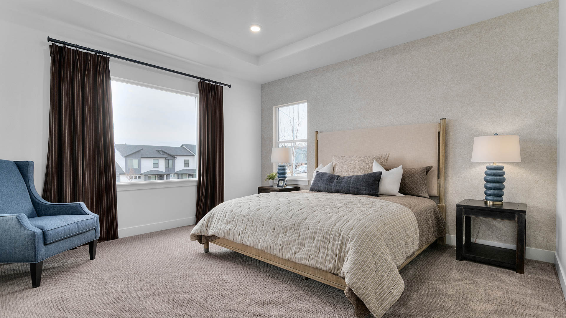 Primary bedroom with large window.
