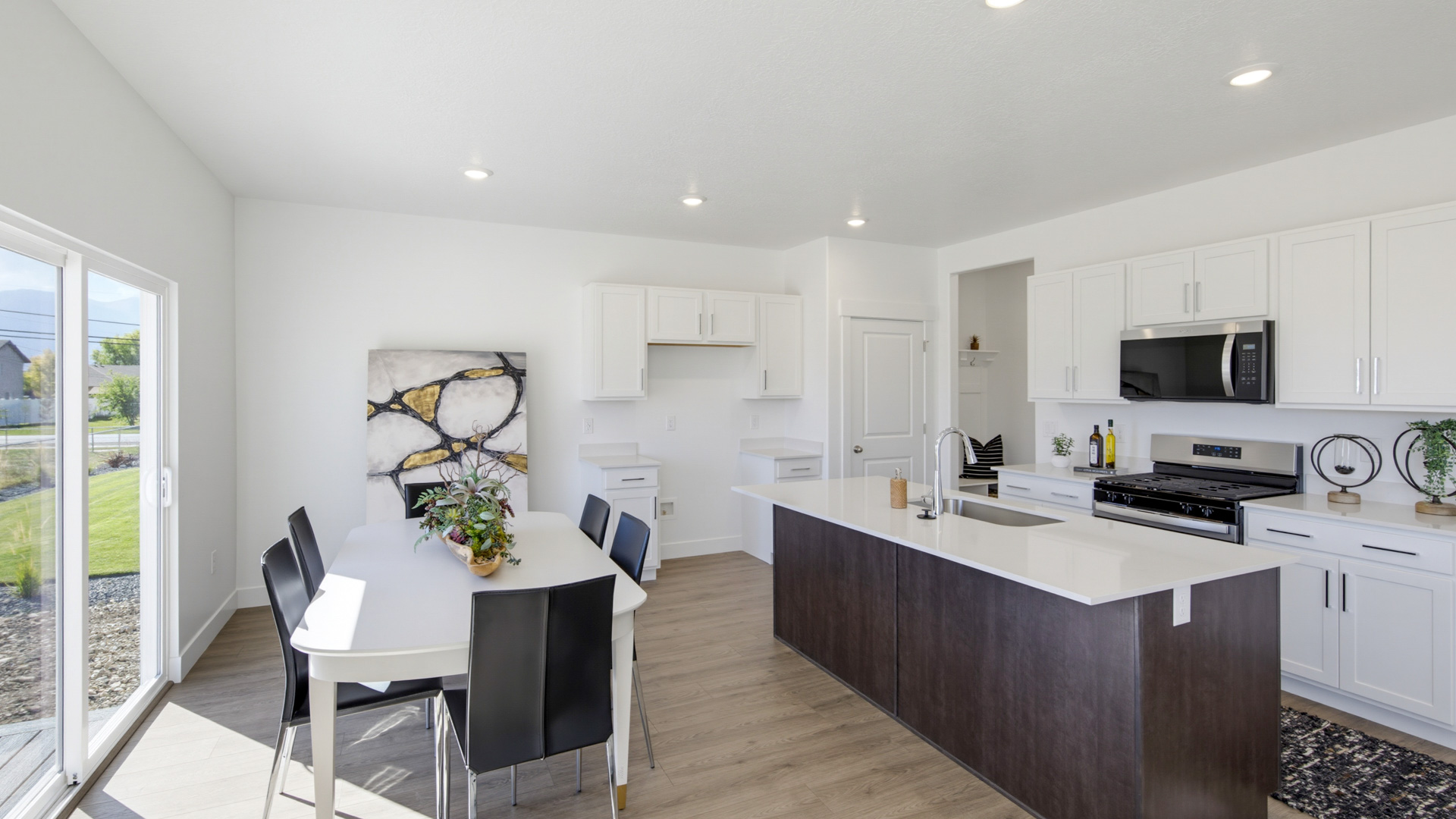 Kitchen and dining with patio doors.
