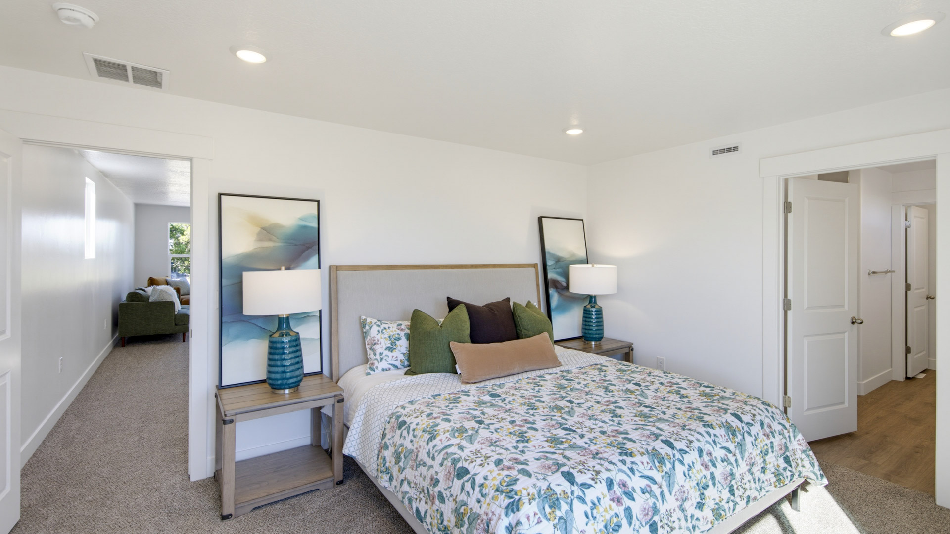 Primary bedroom with large window.