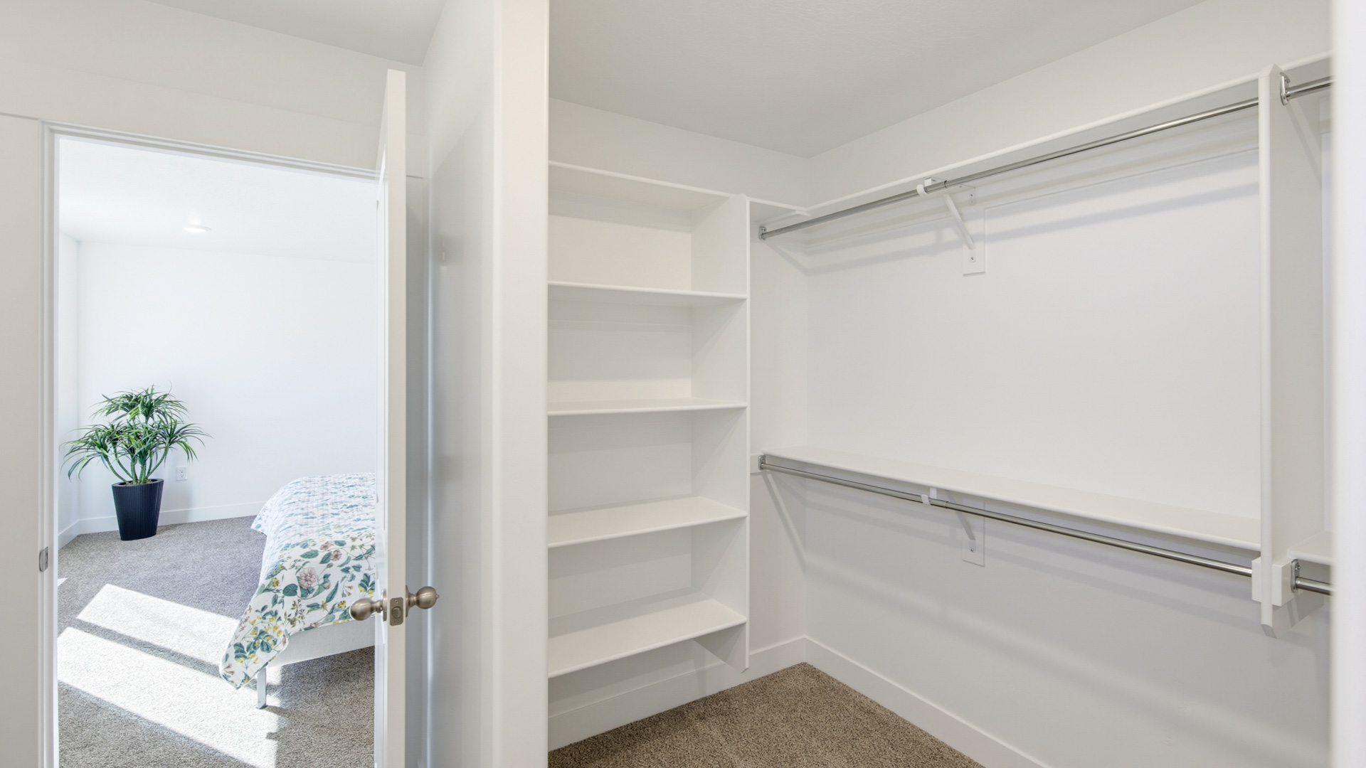 Primary bathroom with shower surround and window above.