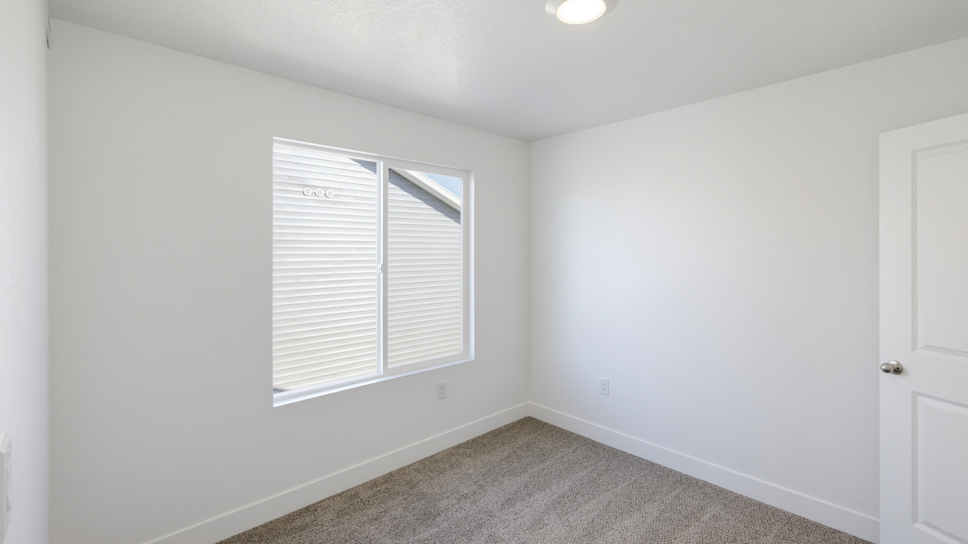 Bedroom with large window.
