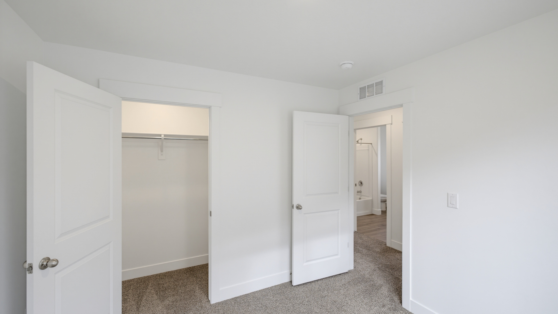 Bedroom with large window.