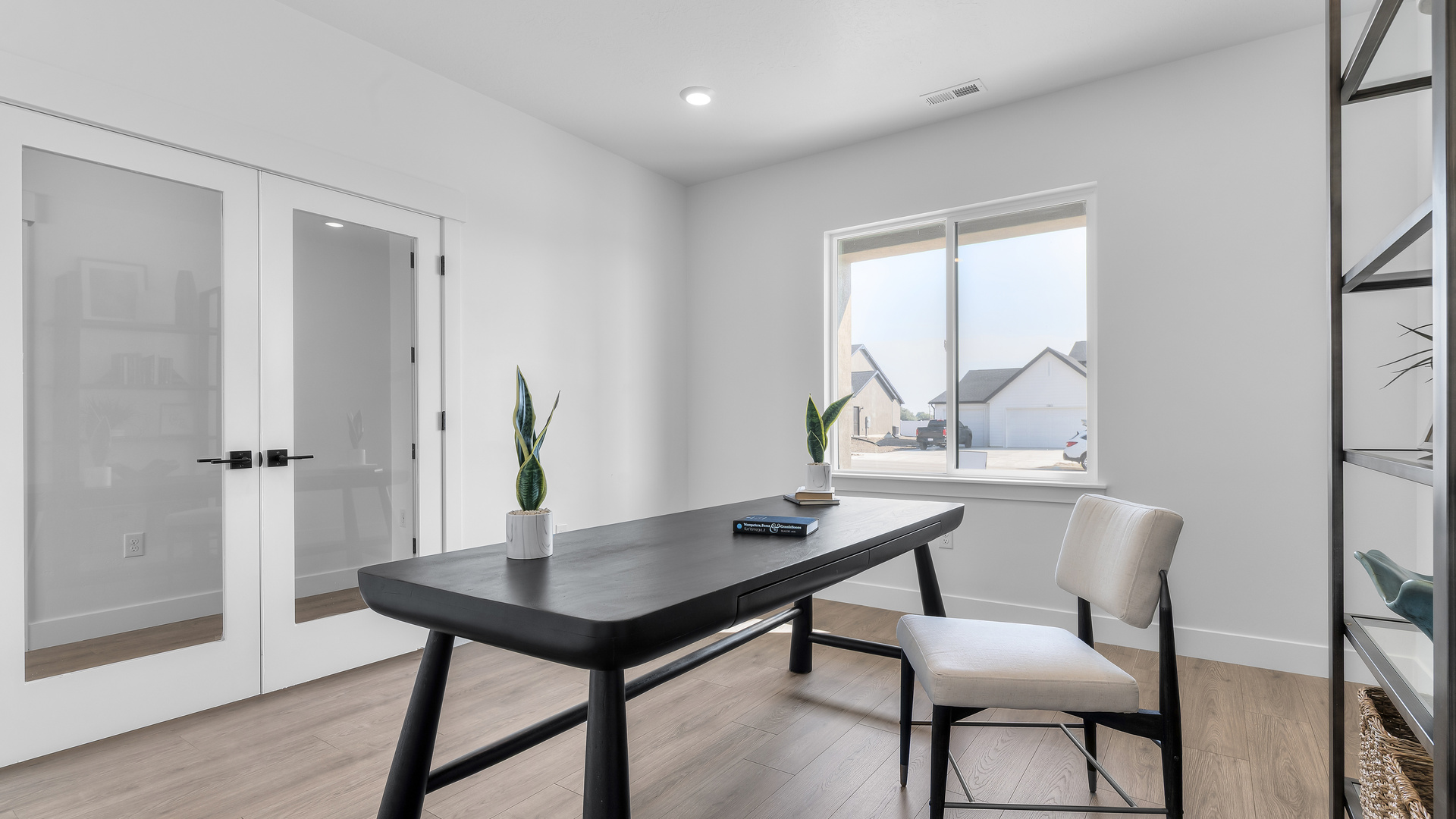 Home office with double doors in hallway