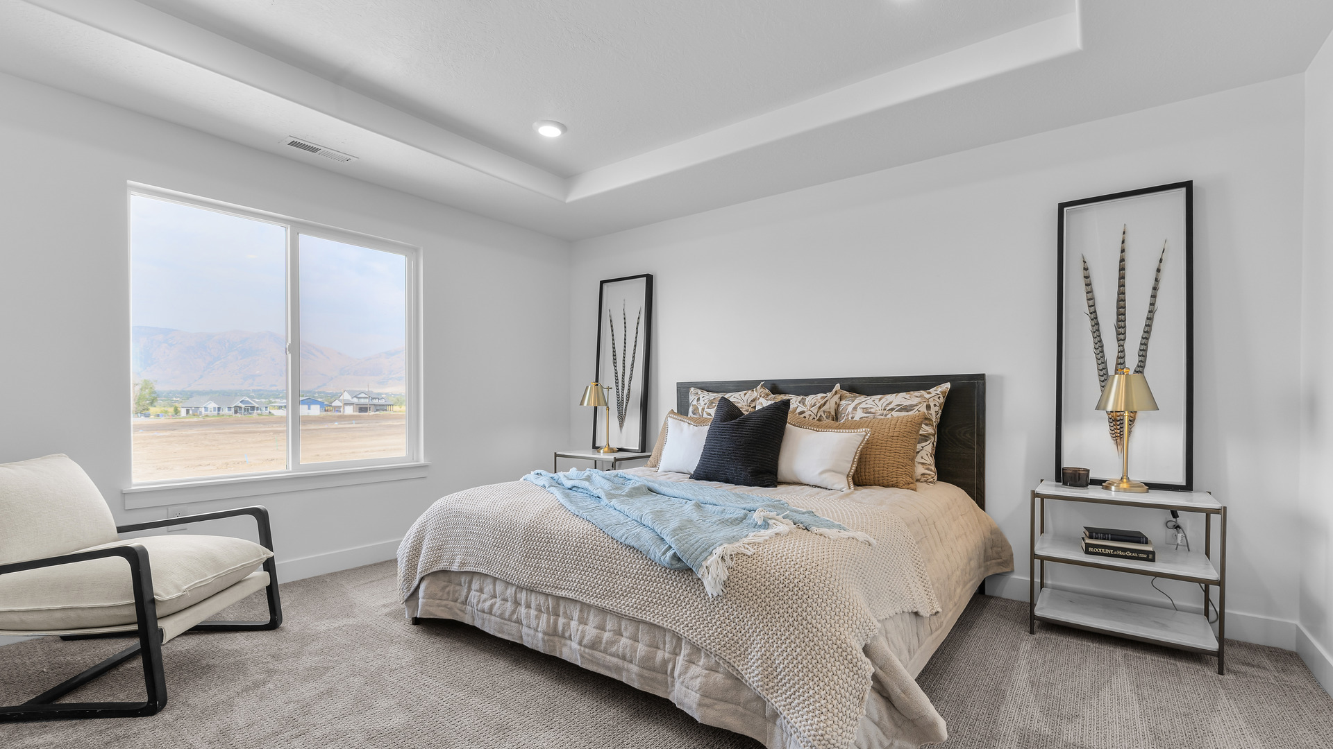 Primary bedroom with large windows