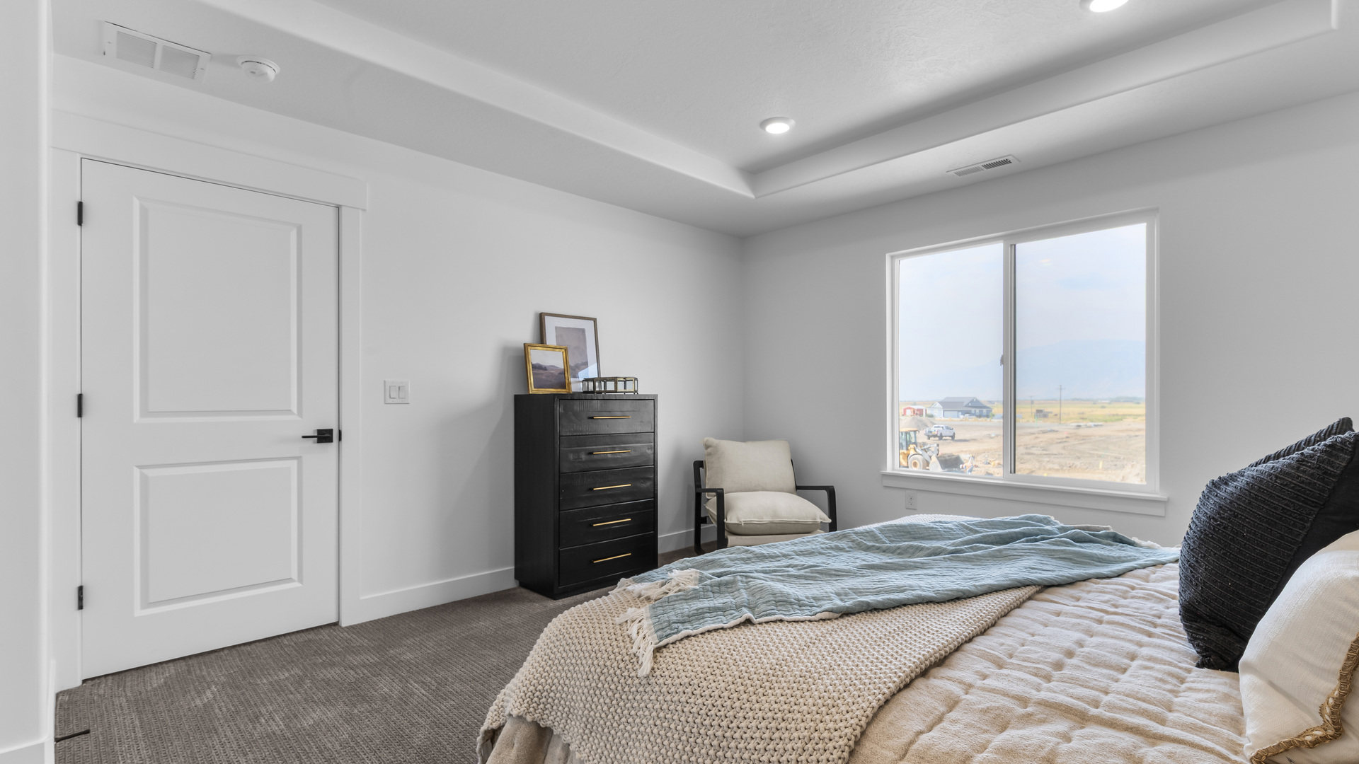 Primary bedroom with large windows