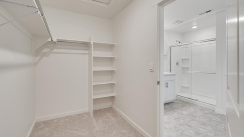 Henley Primary Bedroom walk in Closet by Sky Ranch by D.R. Horton