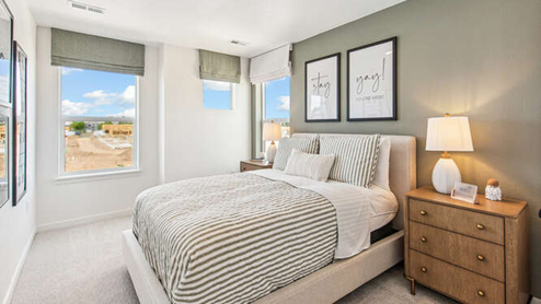 Furnished Melbourne model home secondary bedroom with 2 operable windows.