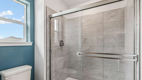 Alternate view of furnished Muirfield model home private bath large glass-enclosed shower