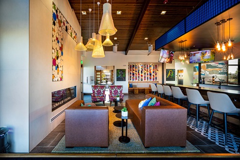 Inside view of Harmony community club house with modern fireplace and bar areas