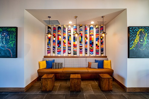 Modern seating nook inside club house of new home community Harmony by D.R. Horton