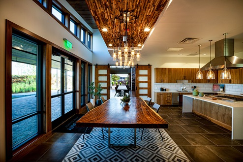 Community dining area and kitchen at Harmony club house