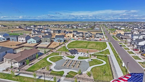 Aerial view of community garden, picnic area and other outdoor amenities with homes in Aurora, Colorado