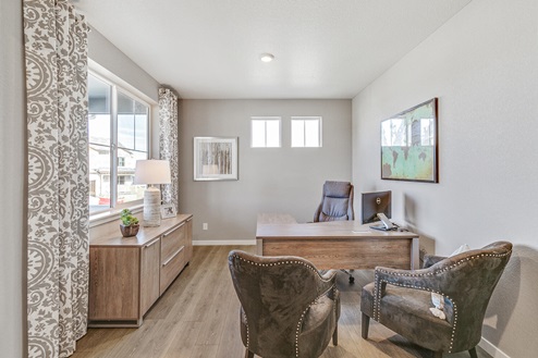 Home office located in model home at Crystal Valley Pine Ridge displaying large functional windows plus two clerestories