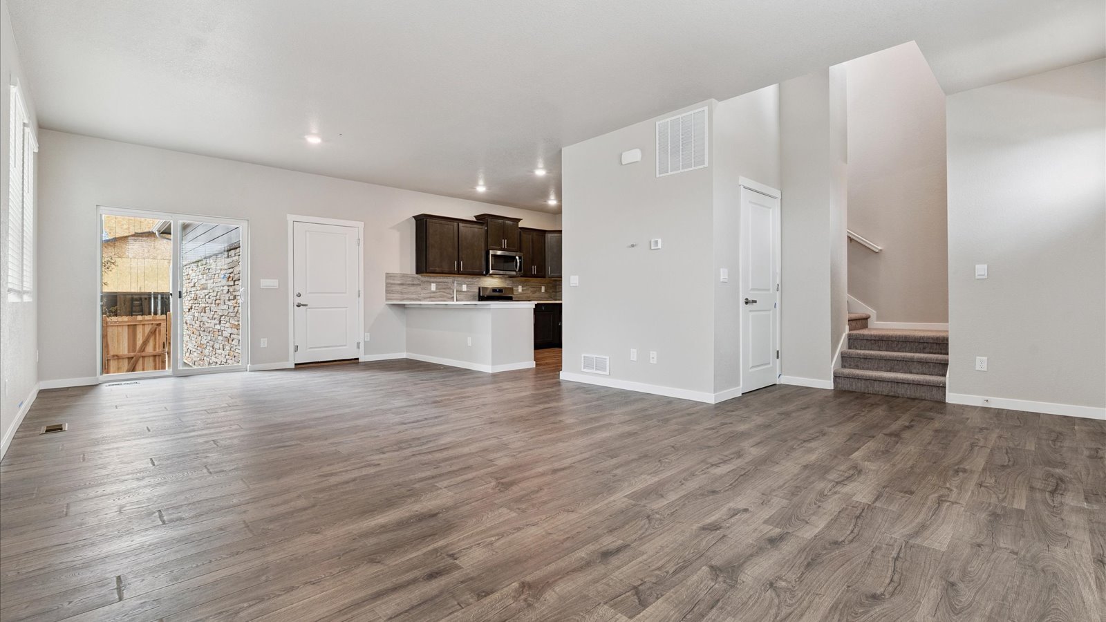 Open concept main floor layout in new home at Sky Ranch Community in Watkins, Colorado