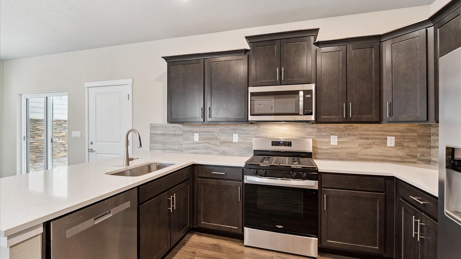 Kitchen area with new finished in new D.R. Horton home in Sky Ranch community
