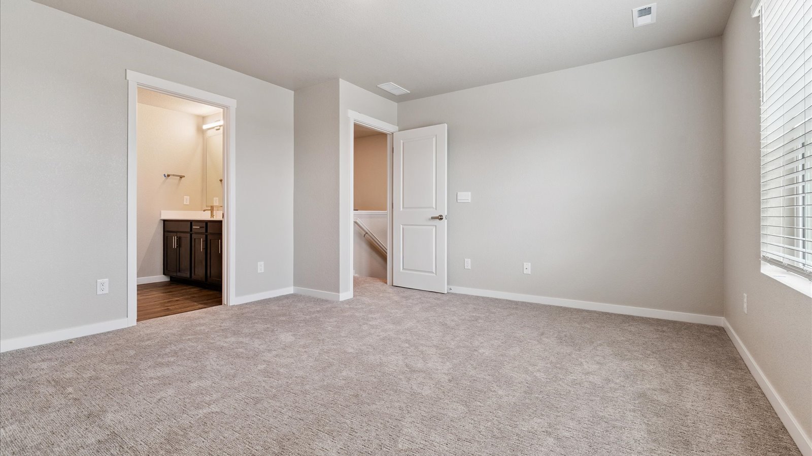 Primary bedroom in new D.R. Horton home in Watkins, Colorado