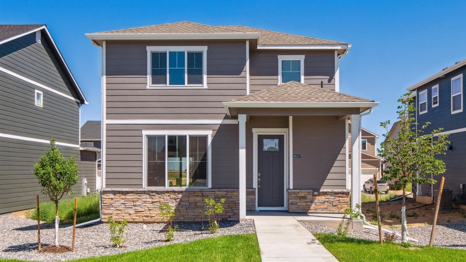 Exterior of two story D.R. Horton home at Sky Ranch community in Watkins, Colorado