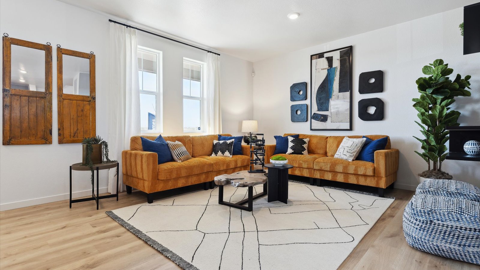 Living room with large windows in new D.R. Horton home in Colorado