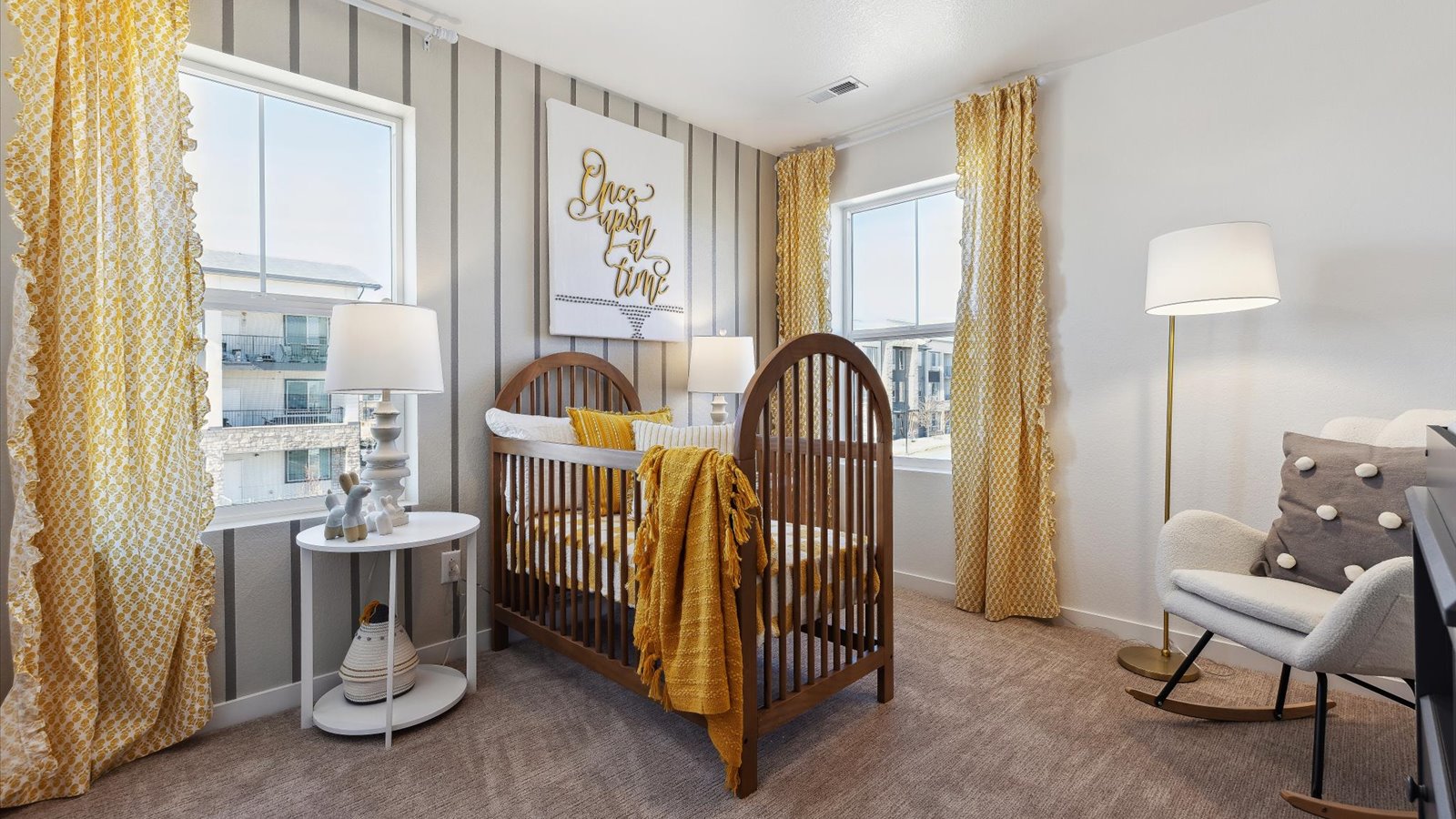Secondary bedroom with large windows in new D.R. Horton home in Colorado